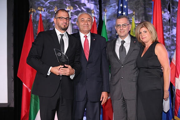 Sevag Koundakjian and Lalig Koundakjian receiving their late father's, Varoujan Koundakjian, Legacy Award. 