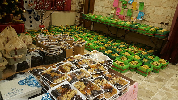 Distribution of food stuff in Aleppo during the Christmas Season