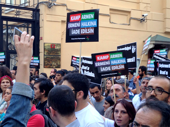 Demonstrators hold up signs demanding the return of Camp Armen in Istanbul on June 26 (Photo: Nanore Barsoumian)