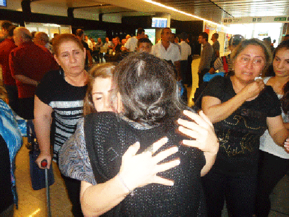 Tomassian family members greet one another at Yerevan's airport