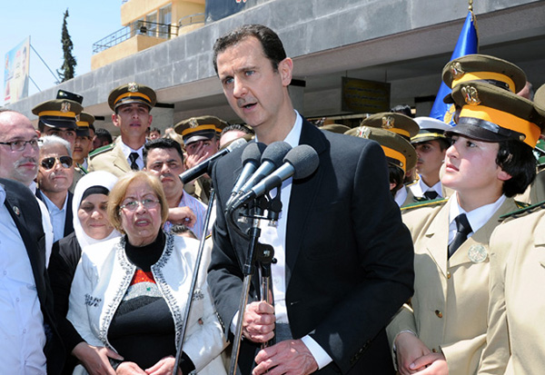 President Bashar al-Assad speaks during a ceremony at a military school in Damascus